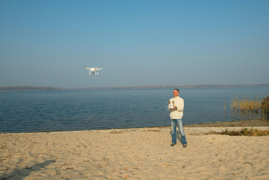 Man controls quadrocopter, drone