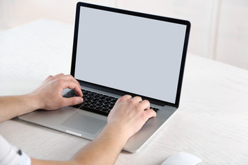 Man working with laptop in office
