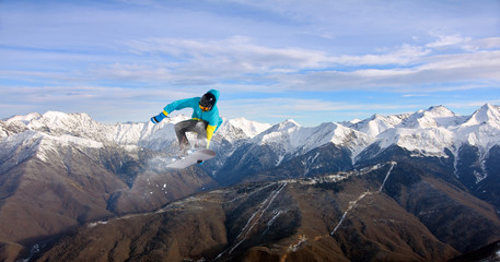 Flying snowboarder on mountains, extreme sport