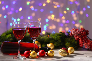 Wine and Christmas decoration on bright background