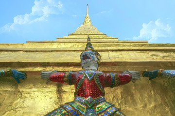 Giant/Giant statues carrying pagoda with blue sky background.