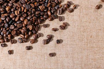 Roasted coffee beans on the linen fabric