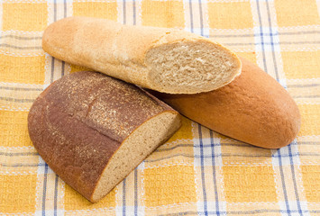 Different types of bread on a checkered tablecloth