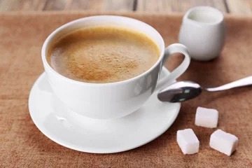Kissenbezug Cup of coffee with cream and sugar on sackcloth © Africa Studio