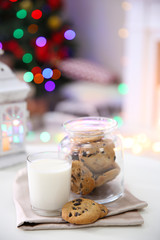 Christmas cookies and glass of milk on table at home