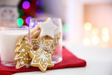 Fototapeta na wymiar Christmas cookies and glass of milk on table at home