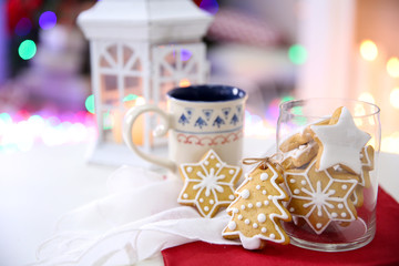 Christmas cookies and cup of tea, on table at home