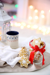 Christmas cookies and cup of tea, on table at home
