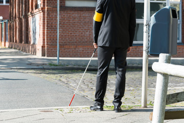 Blind Man With White Stick On Street