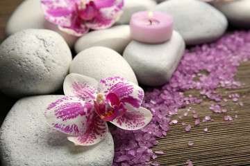 Spa stones with candles and salt closeup