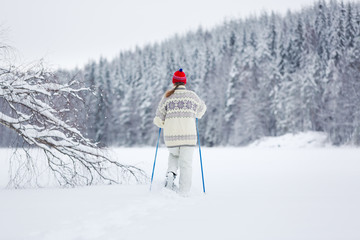 Middle-aged woman snowshoeing