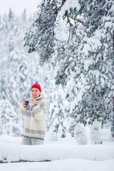 Middle-aged woman having a winter picinc