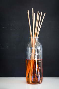 Aroma reed diffuser: sticks in old measuring bottle filled with scent liquid