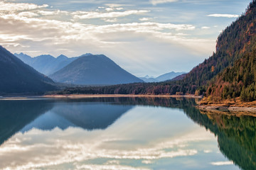 Fototapeta na wymiar autumn panorama landscape - lake trees mountains