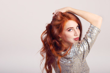 Close-up portrait of beautiful young girl with red hair 