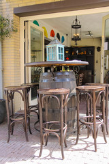 Fototapeta na wymiar Original wooden table and chairs of street cafe. Zandvoort, the