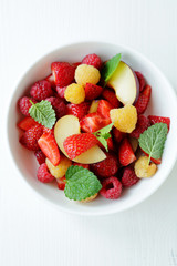 summer fruits salad in bowl
