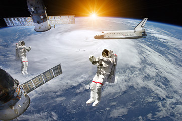 Astronauts, Space Station and Shuttle in outer space - Elements of this image furnished by NASA © Jürgen Fälchle