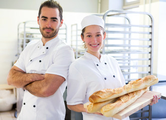 Obraz premium Team of bakers working at the bakery
