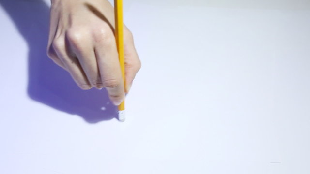 Female hand holding a pencil and erases. White Background.