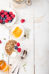 Healthy breakfast. Granola with pumpkin seeds, honey, yogurt, fresh berries .