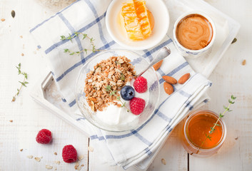 Fototapeta na wymiar Healthy breakfast. Granola with pumpkin seeds, honey, yogurt, fresh berries .