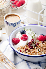 Healthy breakfast. Granola with pumpkin seeds, honey, yogurt ,fresh berries.