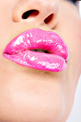  Closeup Beautiful female lips with pink  lipstick.