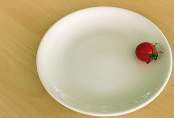 Cherry tomato on white dish