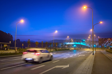 Cars on the highway in the city center of Gdansk at night, Poland