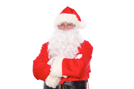 Kind Santa Claus standing with crossed arms, isolated on white background