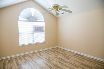 Polished Hardwood Floor in New Home with ceiling Fan