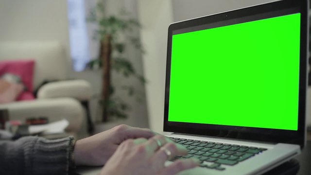 Laptop typing hands green screen - 1080p. Hands typing on a green screened computer - Full HD
