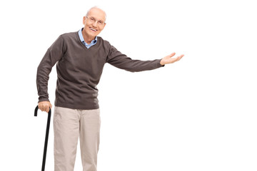 Old man with a cane gesturing with his hand