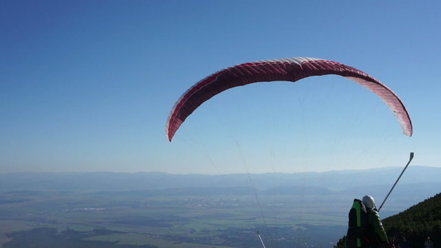Paraglider taking off from a mountain - start, Slovakia