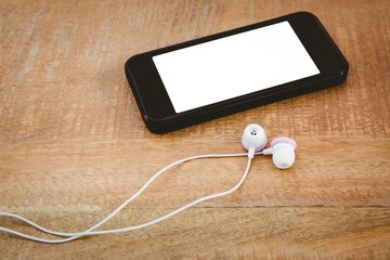Black smartphone with white headphones