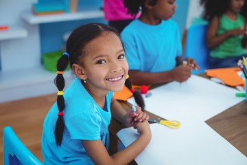 Happy kids enjoying arts and crafts painting