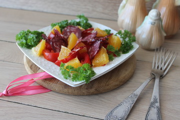 salad with tomatoes, orange and chorizo