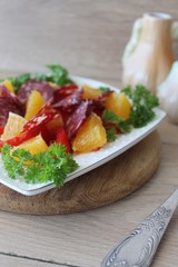 salad with tomatoes, orange and chorizo