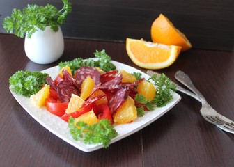 salad with tomatoes, orange and chorizo