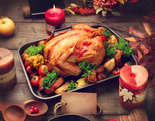 Roasted turkey garnished with potato, vegetables and cranberries. Thanksgiving or Christmas dinner