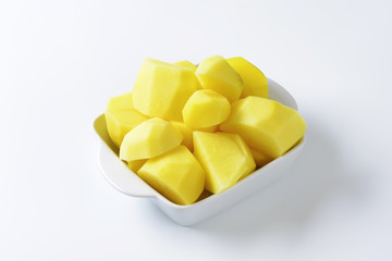 Raw peeled potatoes