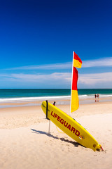 Lifeguard Surfboard On The Beach