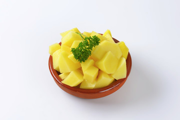 Peeled potatoes cut in pieces