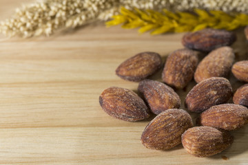 Almond on wood background
