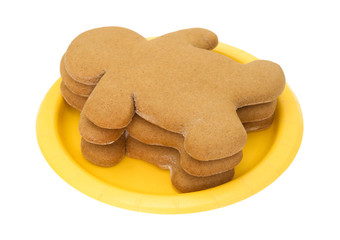 Gingerbread men on a yellow paper plate