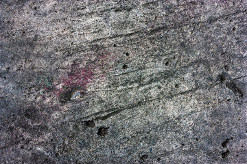 Cement floors are old and dirty.