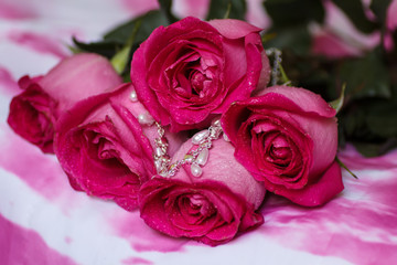 Festive bouquet of crimson roses lying on a light background