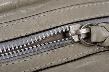 Gray Leather zipper closeup, shallow DOF