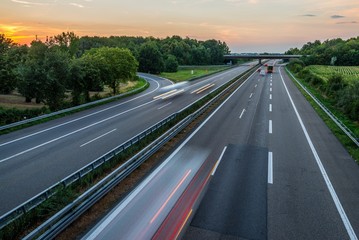 Sunset long-exposure over a german highway - obrazy, fototapety, plakaty